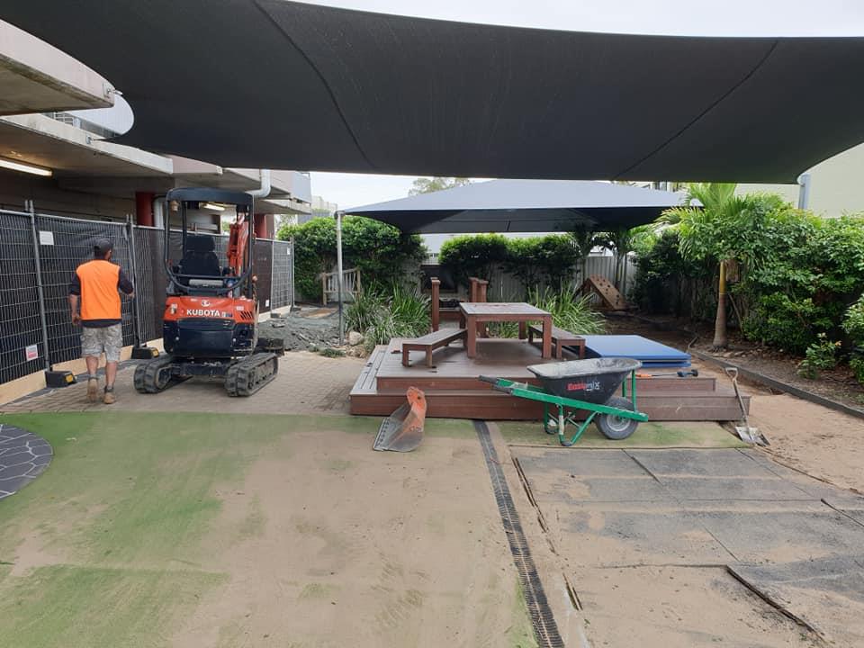 Preparation for laying artificial lawn at a child care centre in Mackay
