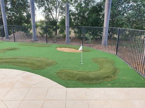 Artificial grass installation for putting green
